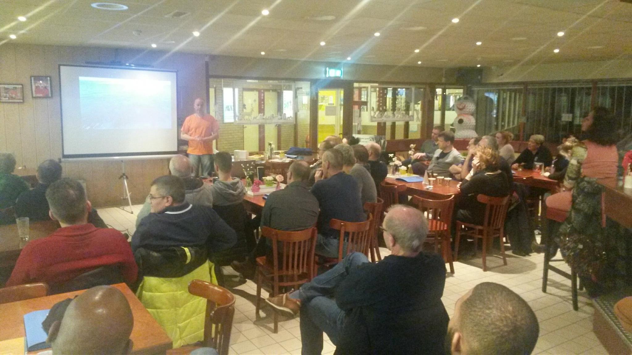 Frank gives a lecture at a diving club.
