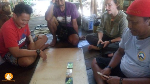 Discussion in all kinds of languages, with smartphones presenting the artificial reefs.