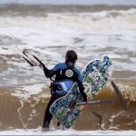Merijn Tinga, the plastic soup surfer, in the waves.