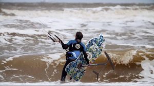 Merijn Tinga, the plastic soup surfer, in the waves.