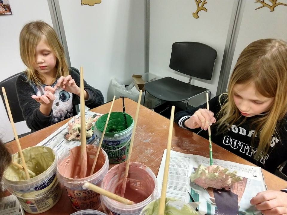Children are painting their art work.